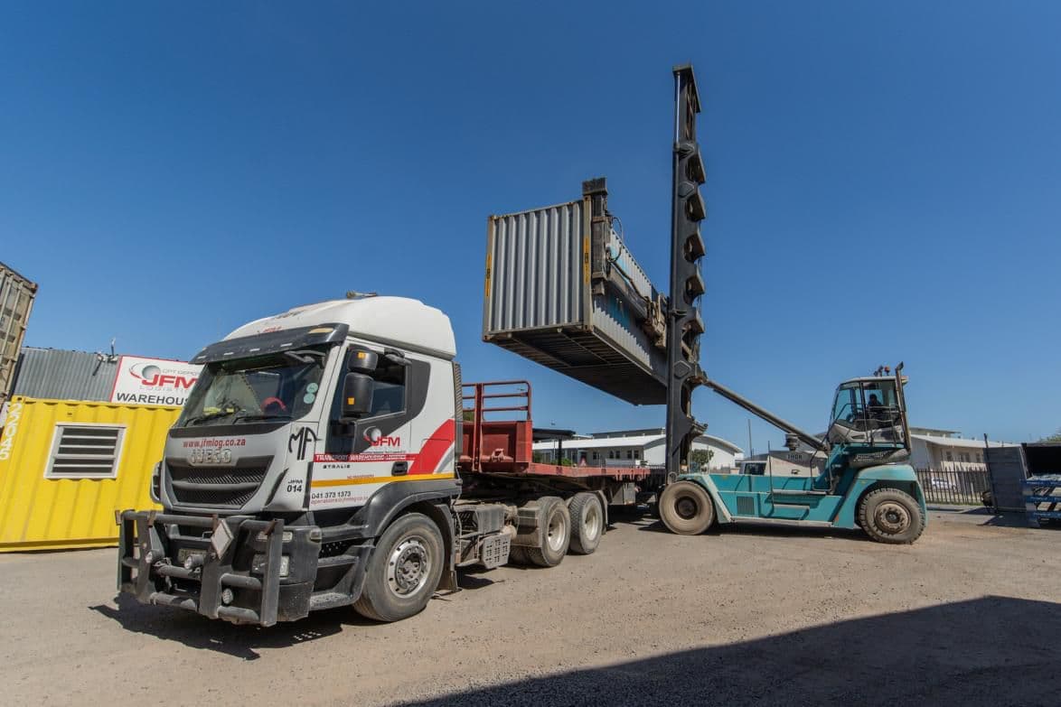 Side-loader placing a container