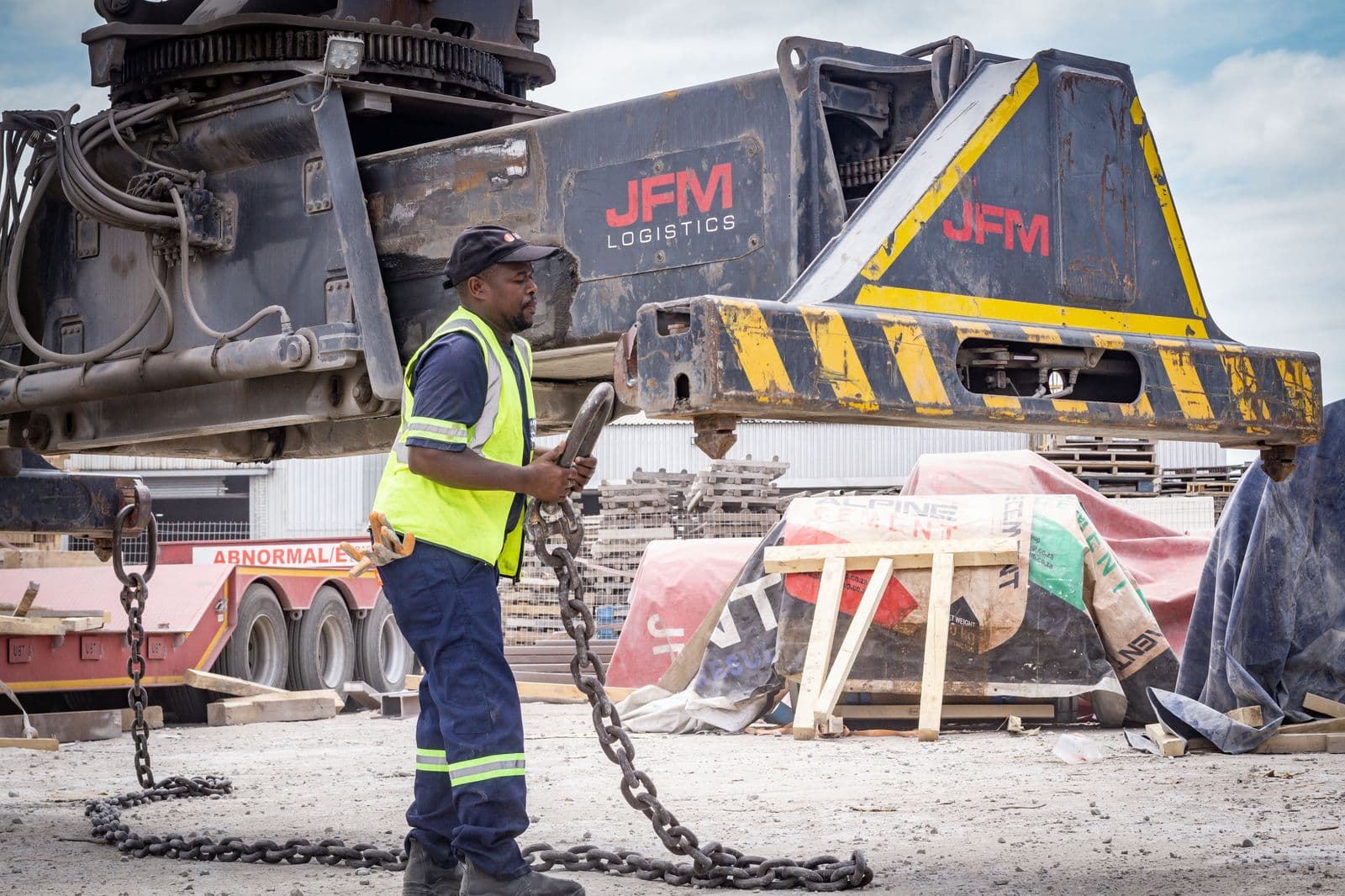 JFM rigger securing chains on an abnormal load